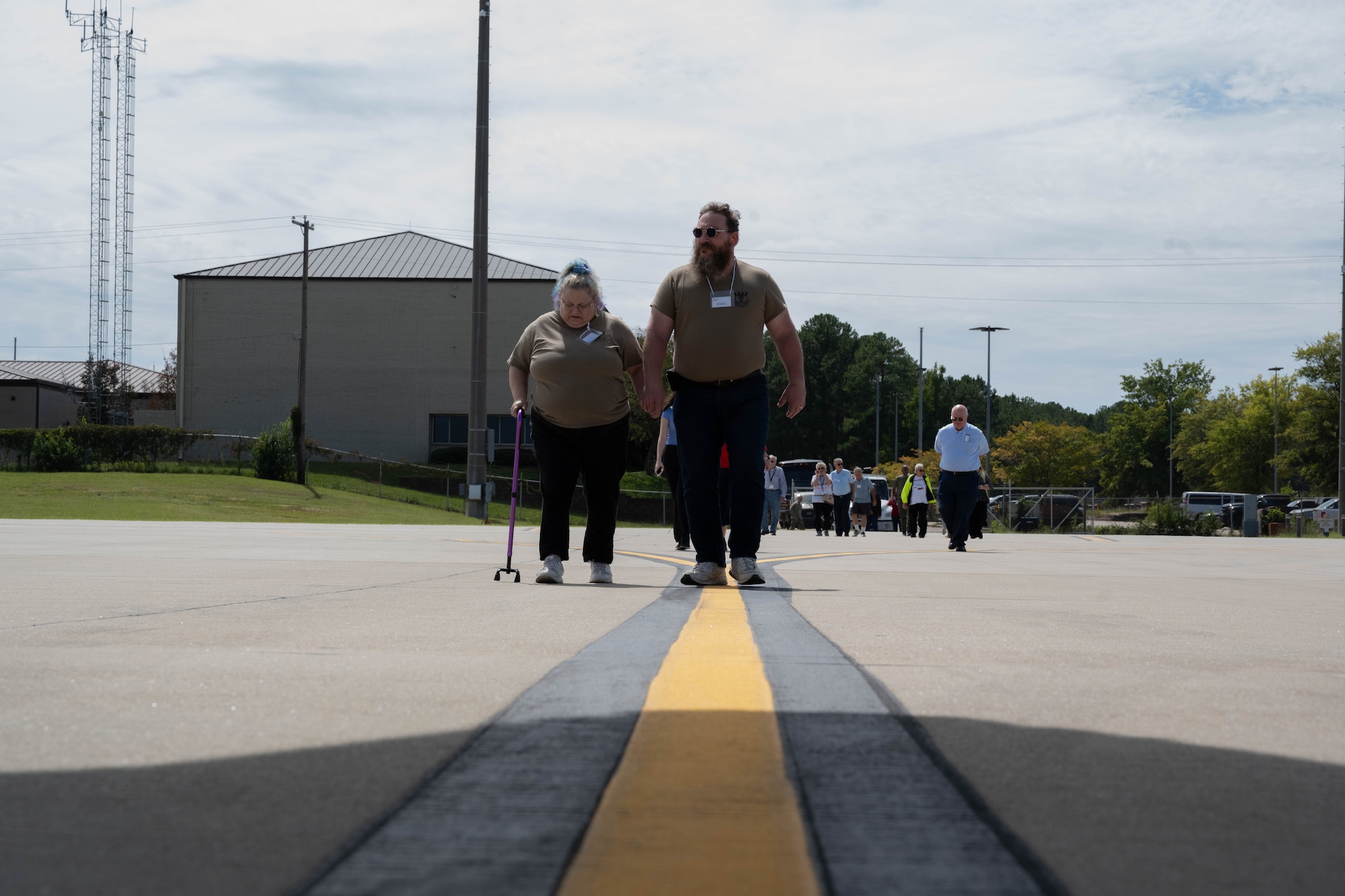 Veterans walk on the flight line.