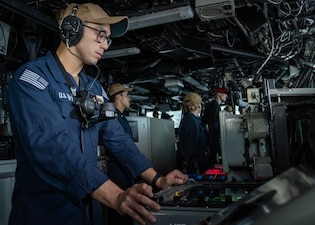 OS2 Jesus Rascon stands watch on the bridge aboard USS Boxer (LHD 4) in the Pacific Ocean.