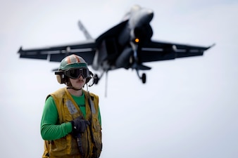 ABE2 Jossue Garcia stands arresting gear officer watch aboard USS Gerald R. Ford (CVN 78).