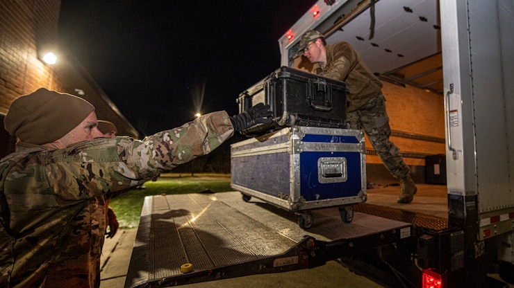 Greg Pflugh and Joe Witt unload a boxtruck.