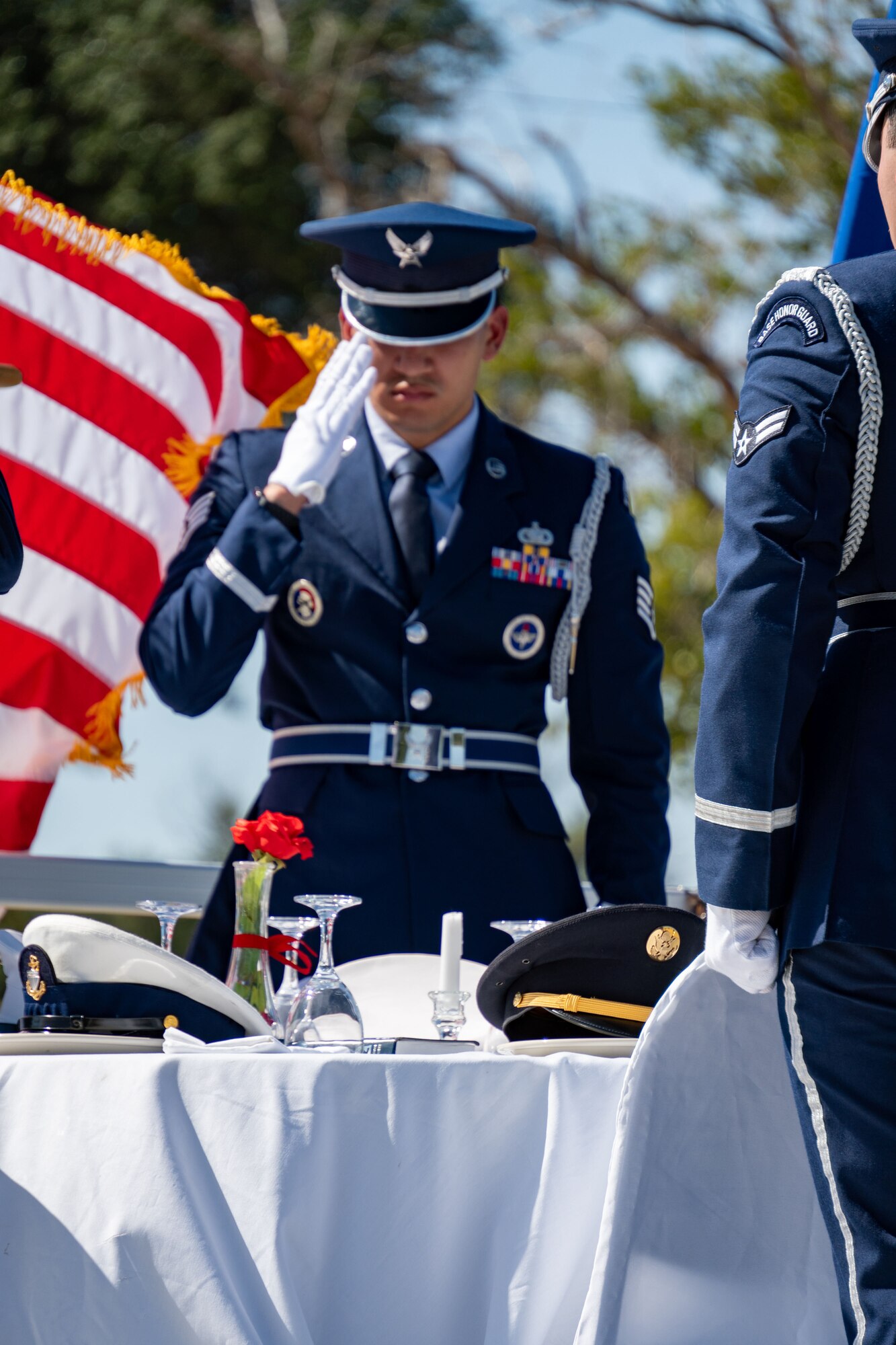 Members of the Sheppard Air Force Base Honor Guard salute during the POW/MIA Missing Man Table Ceremony during the Opening Ceremony for the POW/MIA Remembrance 24-hr Run/Walk/Ruck September 19, 2024, at Sheppard AFB, Texas.