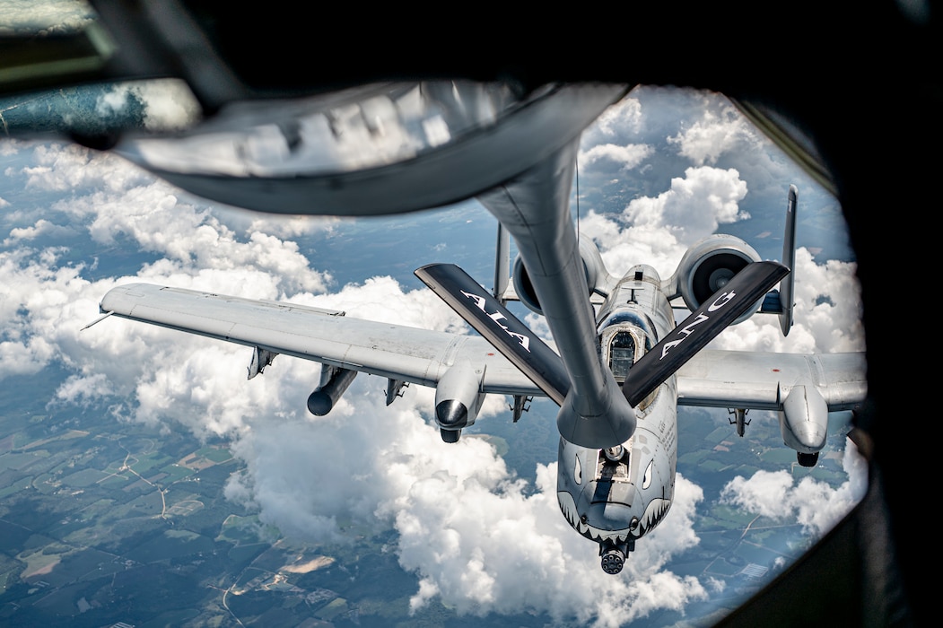 A U.S Air Force KC-135 Stratotanker aircrew from the 117th Air Refueling Wing, Sumpter Smith Joint National Guard Base, Birmingham, Alabama, conduct aerial refueling operations for an A-10C Thunderbolt II assigned to the 75th Fighter Squadron at Moody Air Force Base, Georgia, Sept. 19, 2024. Flying alongside their loved ones, spouses were able to see the precision required for mid-flight refueling. (U.S. Air Force photo by Senior Airman Leonid Soubbotine)