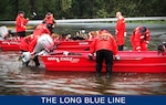 Shallow-Water Response Team 3 crewmembers rescued four pit bulls, 11 beagles and their owners from rising flood waters caused by Hurricane Florence in Delco, North Carolina, September 16, 2018. The Coast Guard is conducting search and rescue operations in support of state and local emergency operation centers. (U.S. Coast Guard photo by Chief Petty Officer Stephen Kelly)