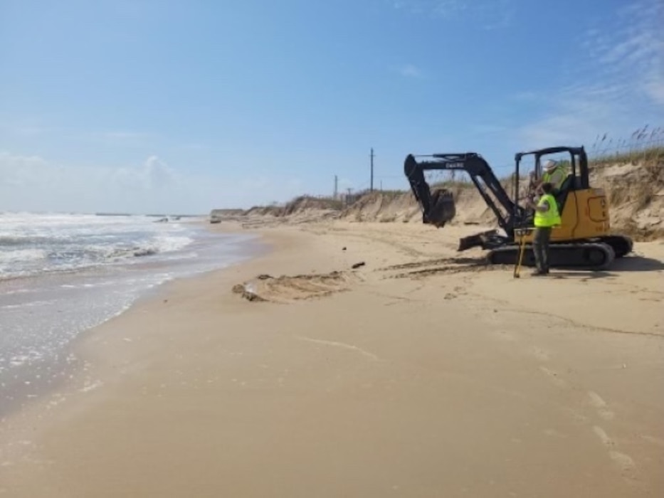 Photo of contractor and equipment on Buxton Beach