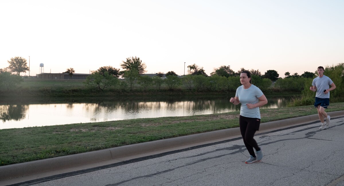 Participants run during the POW/MIA 5K Memorial Run at Goodfellow Air Force Base, Texas, Sept. 18, 2024. The route for the run led participants through several areas of the base in honor of all Americans who are prisoners of war or still missing in action. (U.S. Air Force photo by Airman 1st Class Brian Lummus)