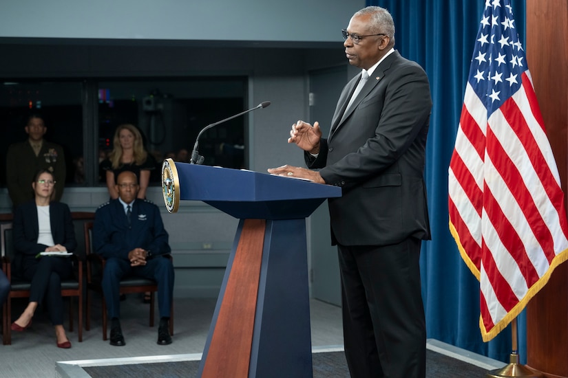 A man speaks from a podium.