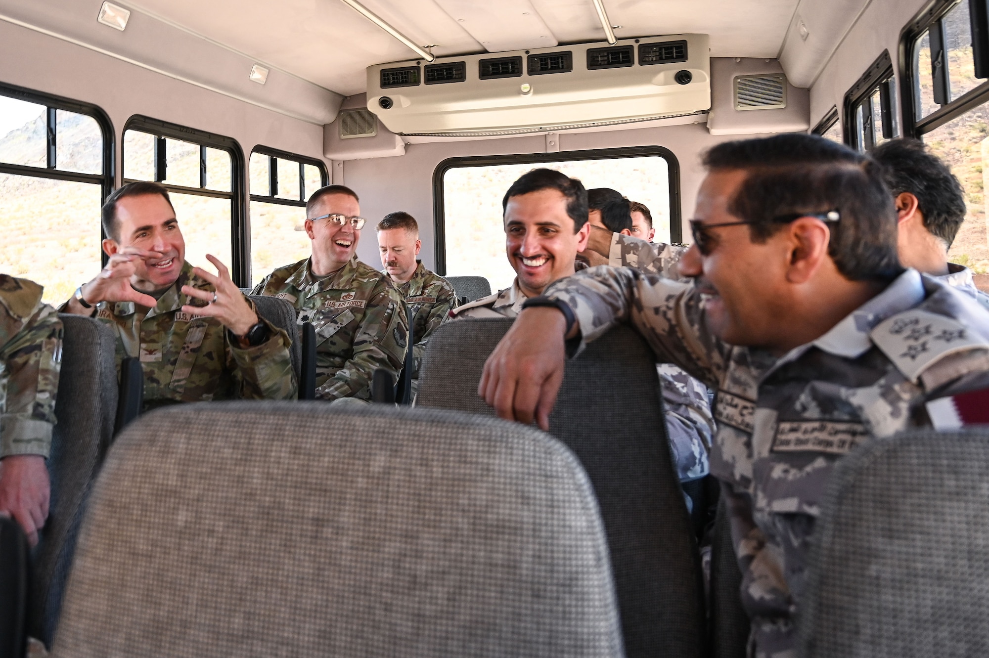 U.S. Airmen interact with members of the Qatar Emiri Corps of Engineers