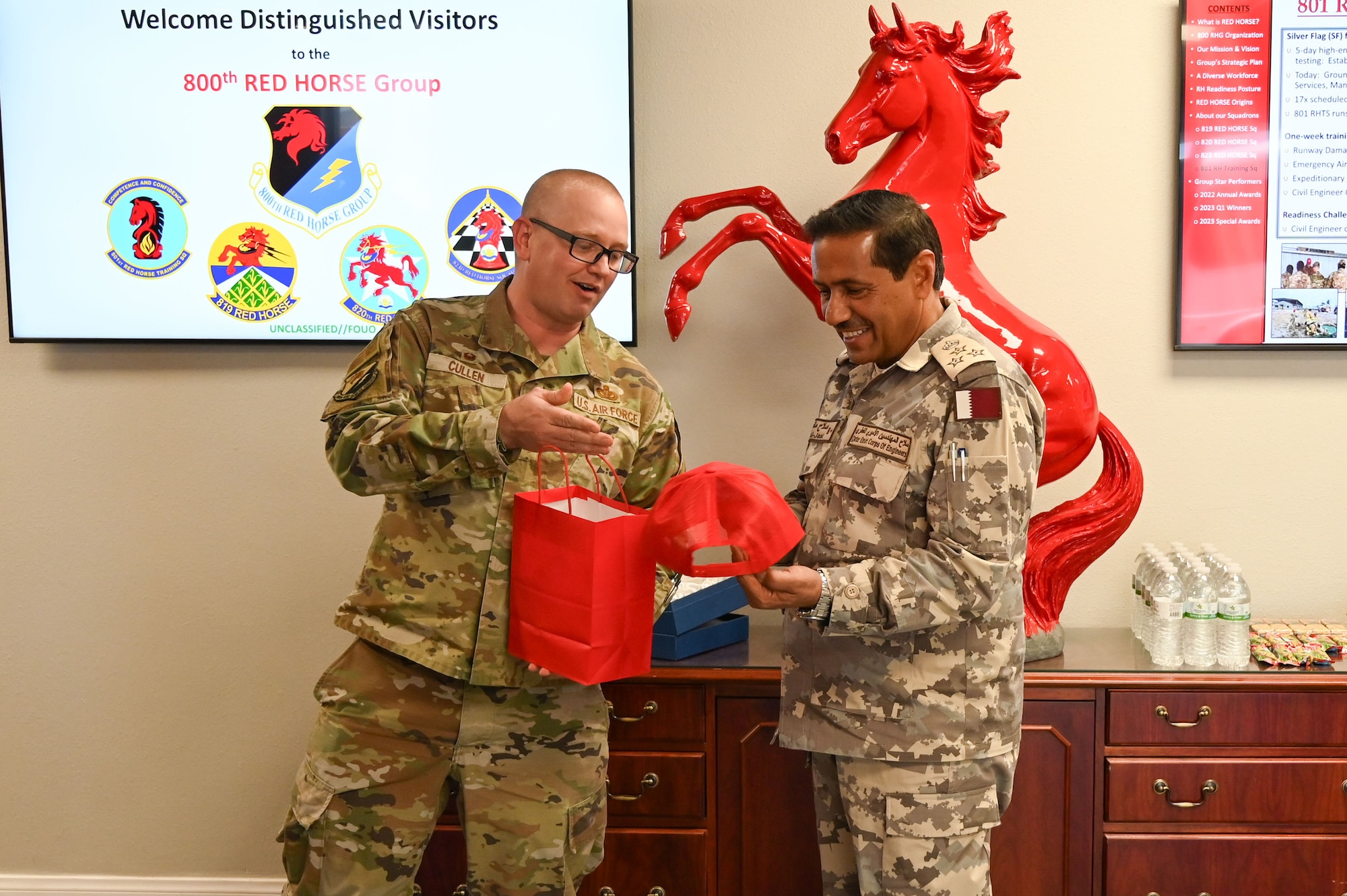 Qatar Emiri Corps of Engineers commander receives a gift from 800th REDHORSE Group commander