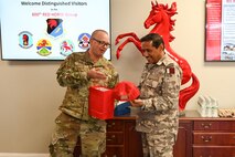 Qatar Emiri Corps of Engineers commander receives a gift from 800th REDHORSE Group commander