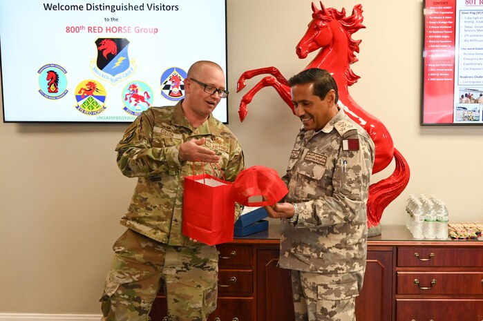 Qatar Emiri Corps of Engineers commander receives a gift from 800th REDHORSE Group commander