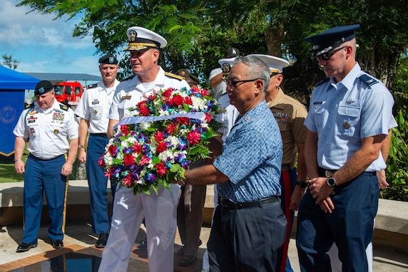 U.S. Navy Rear Adm. Brent DeVore, commander, Joint Region Marianas, retired U.S. Army Lt. Col. David S. Okada and other military leaders on Guam lay a wreath at the 9/11 memorial during a remembrance ceremony at Two Lovers Point, Sept. 20.