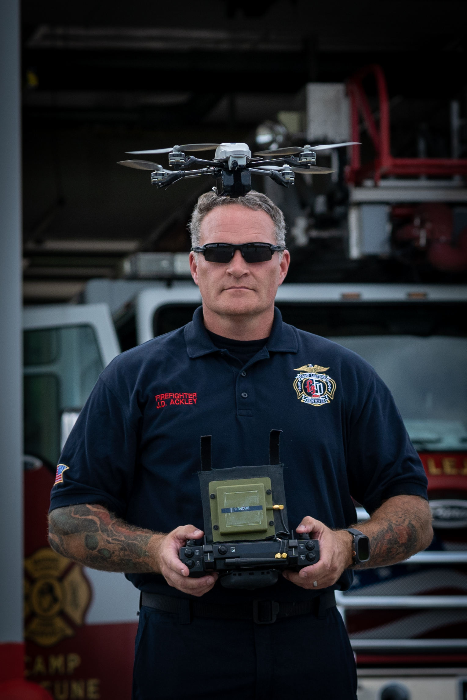 FF Jabbok Ackley, a firefighter with Fire Station 6, Fire and Emergency Services Division (FESD), Marine Corps Base (MCB) Camp Lejeune, pilots a drone in front of Fire Station 6 at Camp Geiger on MCB Camp Lejeune, North Carolina, Sept. 17, 2024. FESD was given the opportunity to be an early adopter of the small Unmanned Aircraft System program in February 2024 and has since then successfully been used in search and rescue operations. (U.S. Marine Corps photo by Cpl. Leo Amaro)