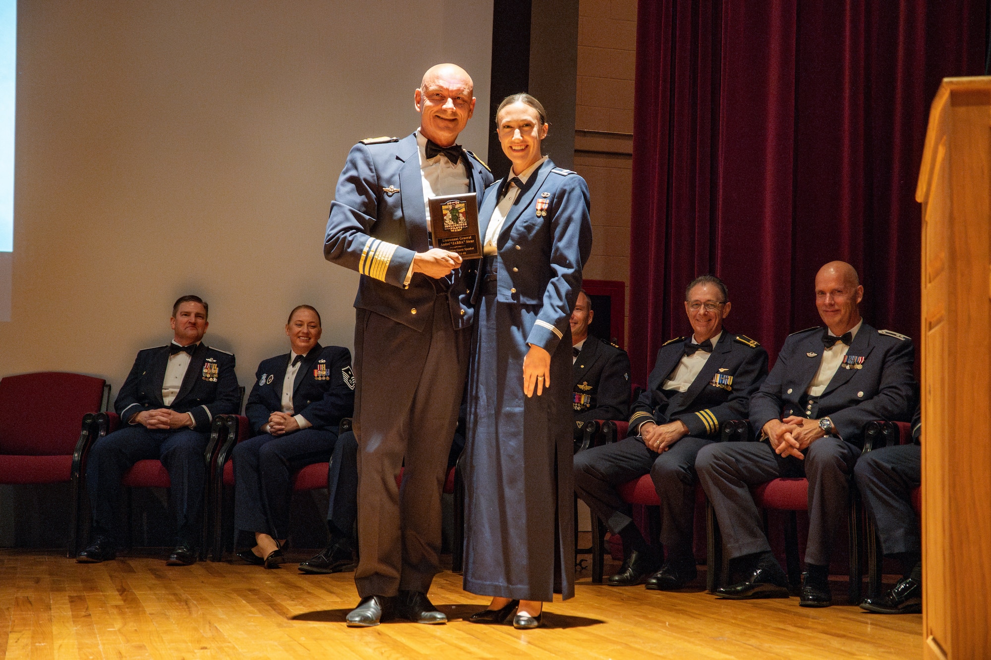 Royal Netherlands Air Force Commander Lt. Gen. André Steur receives a gift from 1st Lt. Alexandra Dobranski