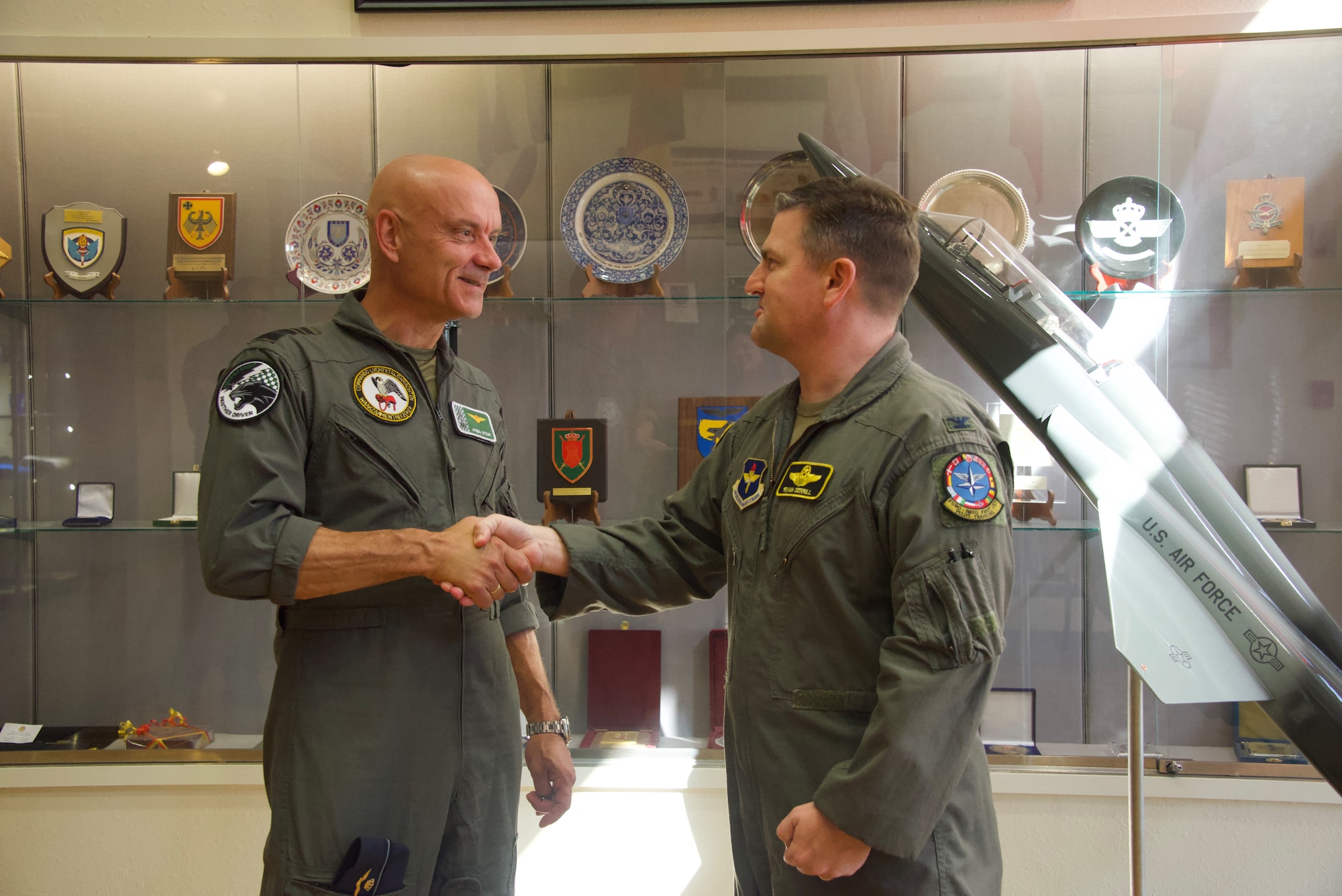 Royal Netherlands Air Force Commander Lt. Gen. André Steur coins U.S. Air Force Col. Ryan Serrill, 80th Flying Training Wing Operations Group commander, recognizing ENJJPT's critical role in training pilots