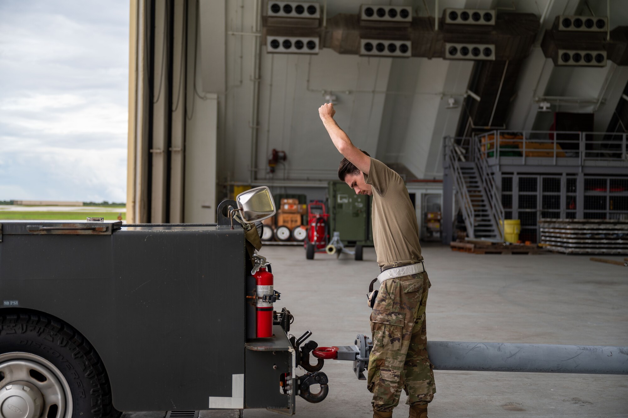 U.S. Air Force Senior Airman Joshua Maver, 4th Reconnaissance Squadron RQ-4B Global Hawk Crew Chief, prepares aircraft for tow by connecting towbar to bobtail on an RQ-4B on Andersen Air Force Base, Guam, Sept. 16, 2024. The RQ-4B provides near real-time aerial imagery reconnaissance support to U.S. and partner nations assisting in a multitude of operations. (U.S. Air Force Airman 1st Class Manasseh Demissie)