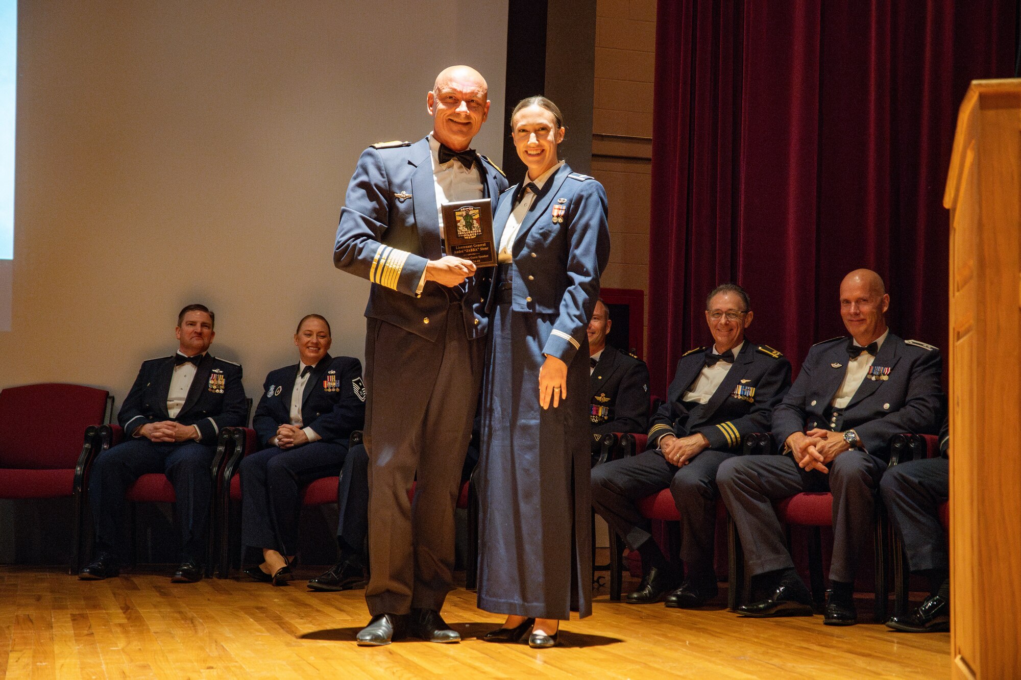 Royal Netherlands Air Force Commander Lt. Gen. André Steur receives a gift from 1st Lt. Alexandra Dobranski