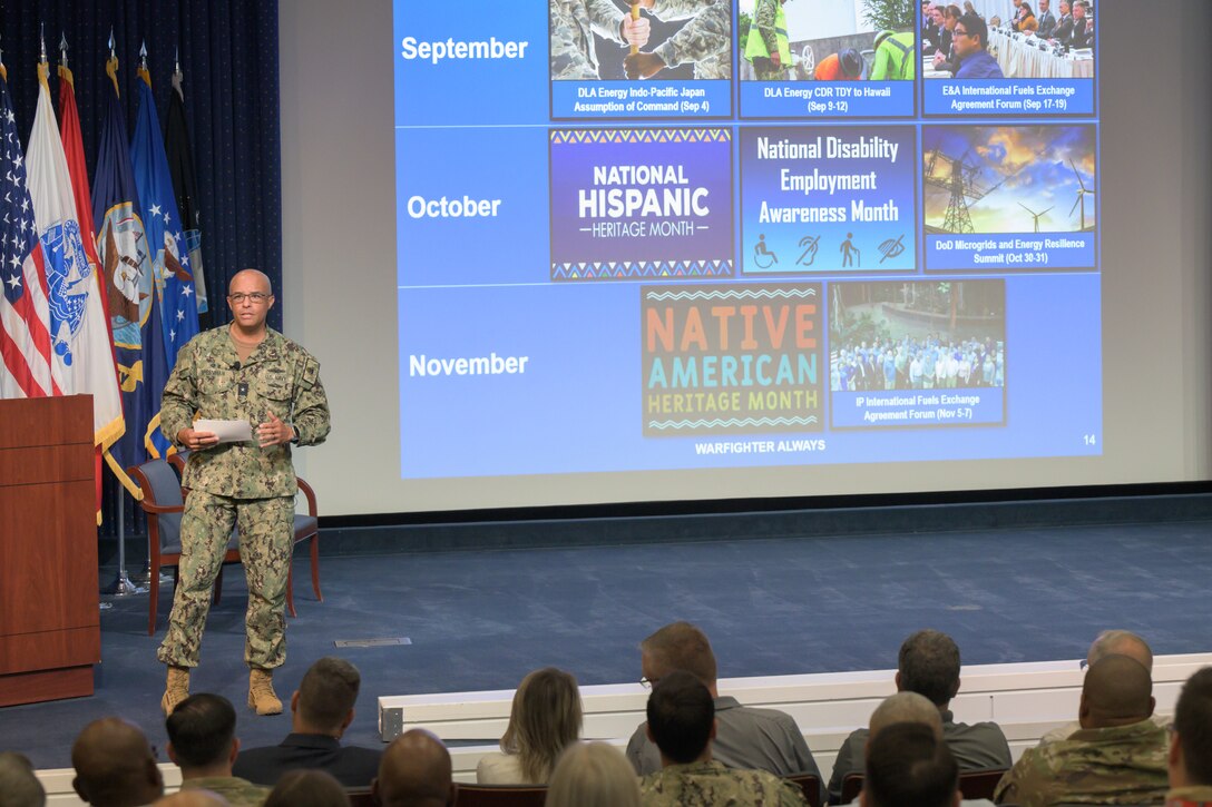 Defense Logistics Agency Energy commander speaks to employees about upcoming events.
