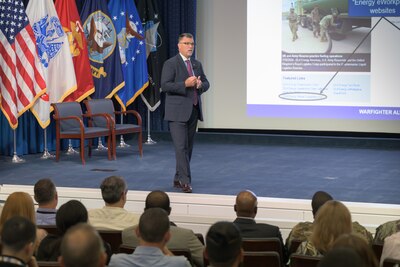 DLA Energy Deputy Commander spoke to employees from inside of an auditorium.