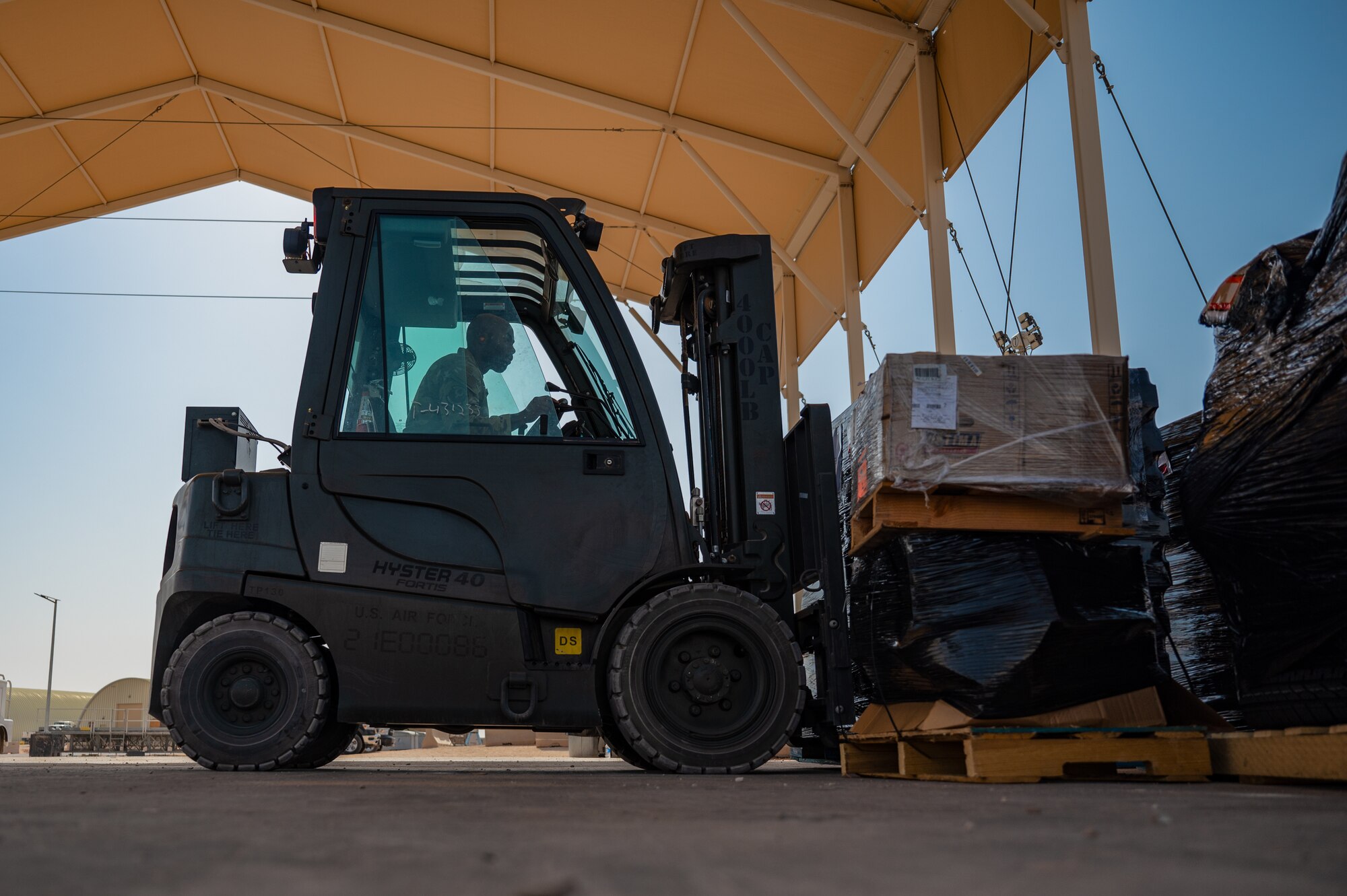 U.S. Air Force 1st Lt. Brian Stone, 378th Expeditionary Communications Squadron plans and resources flight commander, operates a forklift at an undisclosed location within the U.S. Central Command area of responsibility, July 10, 2024. As Stone immersed himself in the ELRS's daily operations and diverse missions, he began to see the bigger picture and adapted to his new role as the director of operations. (U.S. Air Force photo)