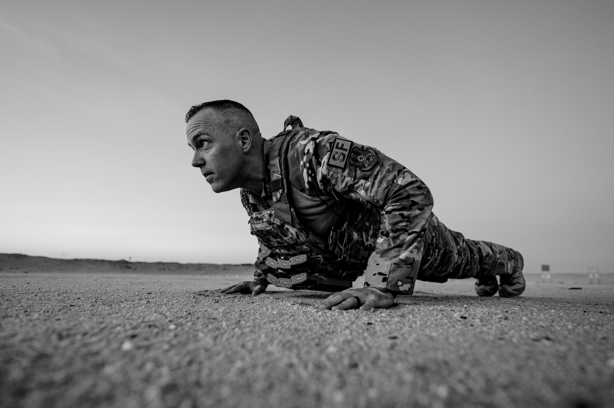 U.S. Air Force Master Sgt. Philip Sneed, 378th Expeditionary Security Forces Squadron operations superintendent, performs hand-release push-ups during a defender workout session at an undisclosed location within the U.S. Central Command area of responsibility, Aug. 6, 2024. Sneed’s excitement to become a first sergeant has been fueled by his strong character and his ambition to help others has laid a foundation from which his leadership can continue to grow. (U.S. Air Force photo by Senior Airman Ryan Hayman)