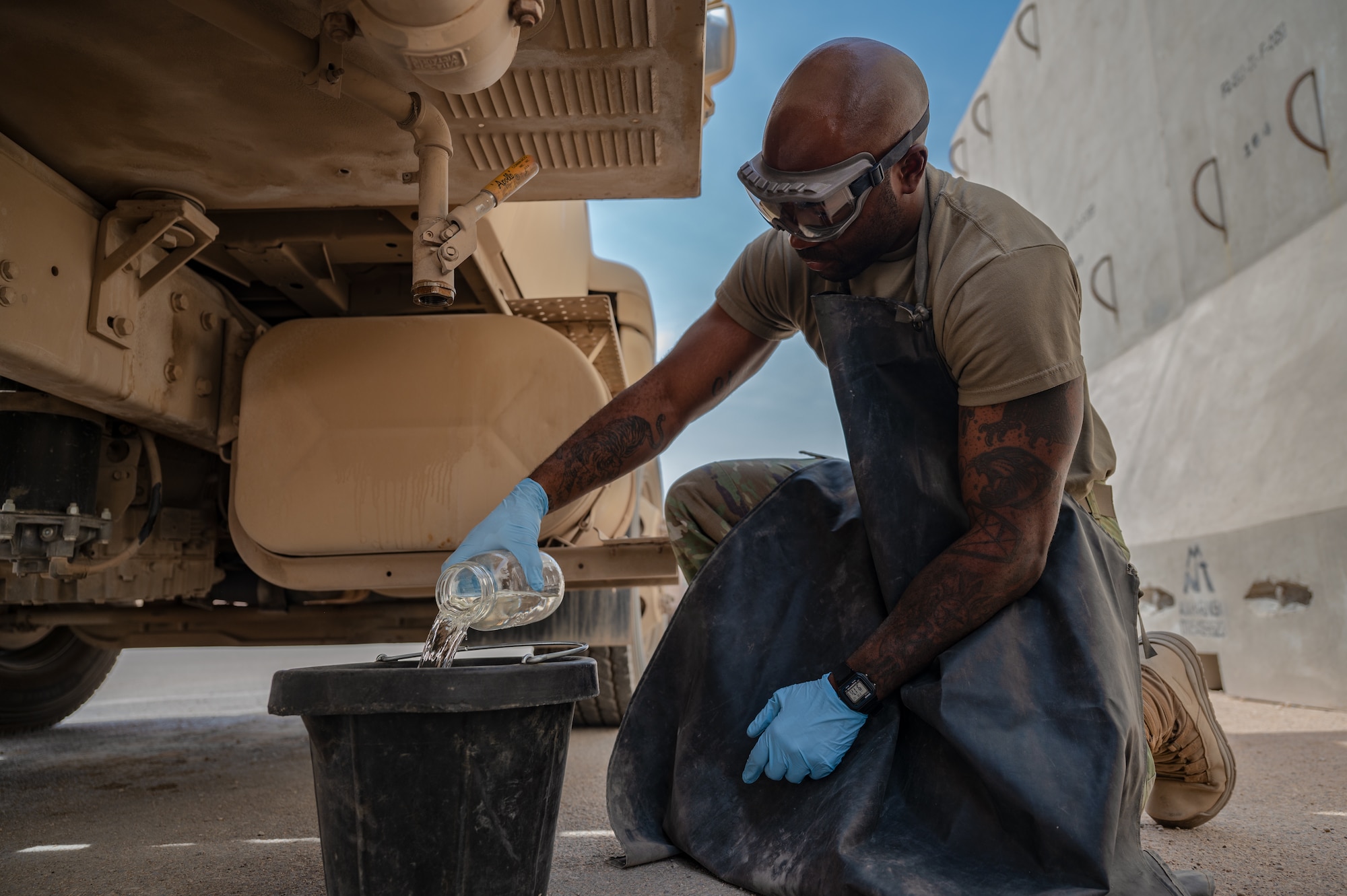 U.S. Air Force 1st Lt. Brian Stone, 378th Expeditionary Communications Squadron plans and resources flight commander, test the fuel of a R11 aircraft refueling vehicle at an undisclosed location within the U.S. Central Command area of responsibility, July 12, 2024. Stone stepped outside the traditional role of a communications Airman to learn and execute the 378th ELRS mission to prepare him to reach his future goal of serving in a combat communications unit. (U.S. Air Force photo)