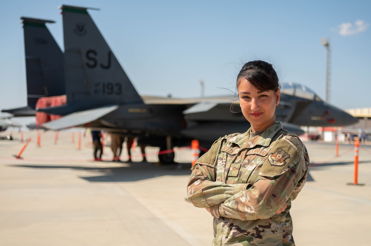 U.S. Air Force Senior Airman Amal Djezzar, 378th Air Expeditionary Wing Host Nation Coordination Cell linguist and contracting specialist, poses for a photo at the Egypt International Airshow, Sept. 4, 2024. Djezzar’s military career highlights the importance of multilingual capabilities in supporting Air Force missions abroad. (U.S. Air Force photo)