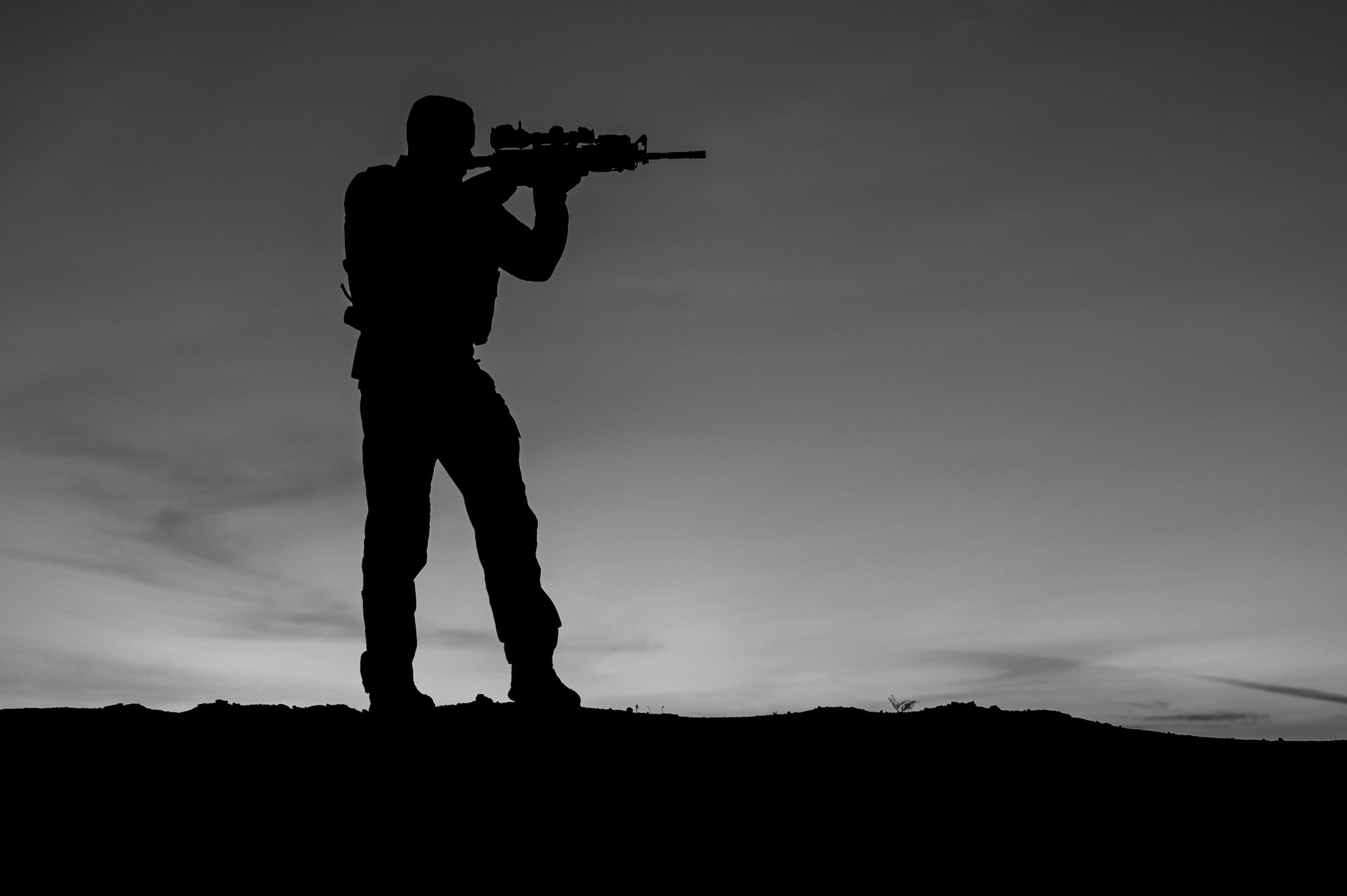 U.S. Air Force Master Sgt. Philip Sneed, 378th Expeditionary Security Forces Squadron operations superintendent, is posted to enhance security during a patrol at an undisclosed location within the U.S. Central Command area of responsibility, Aug. 6, 2024. Sneed is currently completing his final weeks in a security forces unit, preparing to excel in his next chapter as a first sergeant.  (U.S. Air Force photo by Senior Airman Ryan Hayman)