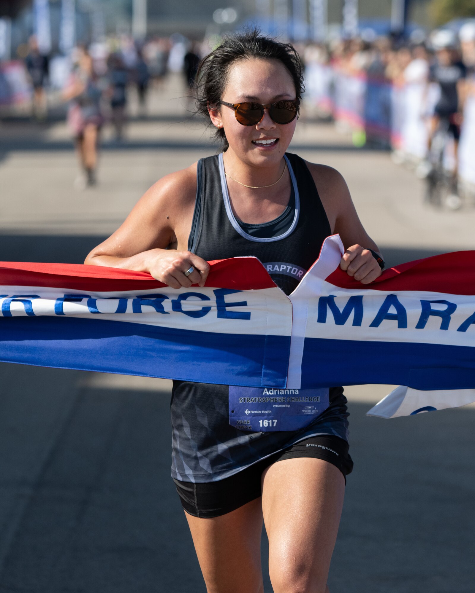 Adrianna Dong crosses the finish line to win the Women's Air Force Marathon Sept. 21, 2024, at Wright-Patterson Air Force Base, Ohio. Dong won with time of 3:13:31. (U.S. Air Force photo by R.J.  Oriez.)