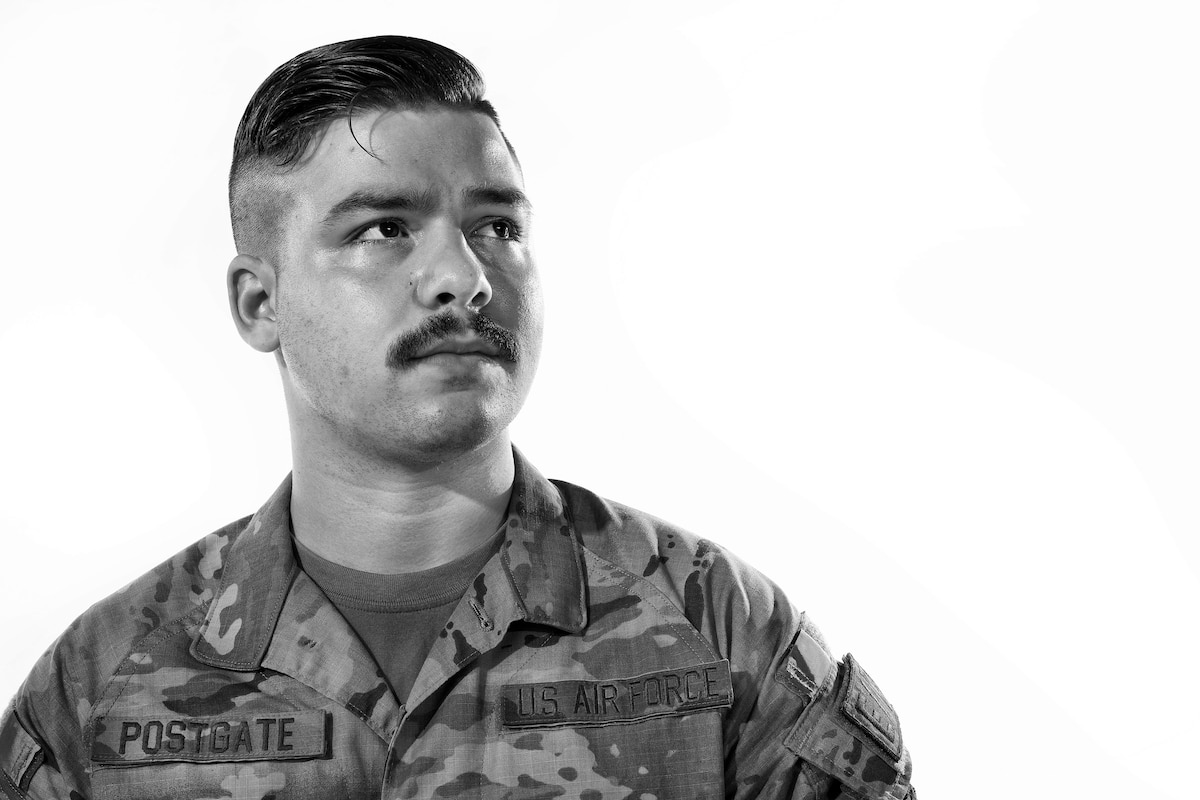 U.S. Air Force Staff Sgt. Boston Postgate, 374th Aircraft Maintenance Squadron electrical and environmental systems craftsman, poses for a photo at Yokota Air Base, Japan.