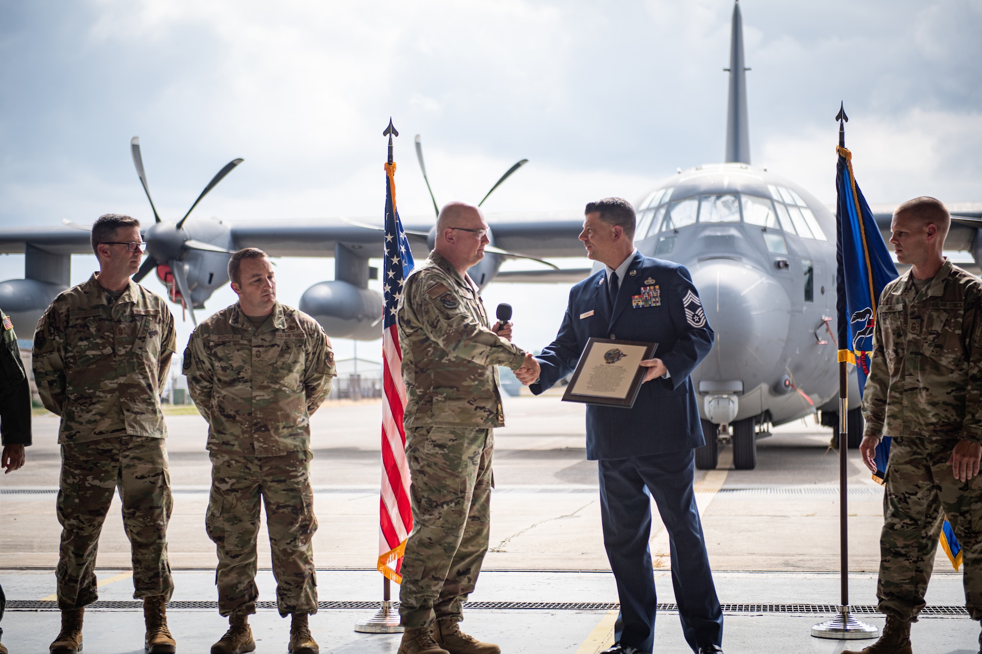 Chief Master Sgt. Robert Smith, left, 193rd Special Operations Wing command chief, presents a plaque to Chief Master Sgt. Erik Barber, 193rd SOAMXS senior enlisted leader, at Middletown, Pennsylvania, September 21, 2024.