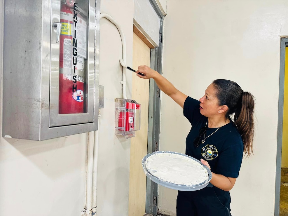 SANTA RITA, Guam (Sept. 12, 2024) - Fire Inspector, Lelani Quenga paints a classroom at Southern High School on Sept. 12. Quenga along with other military and civilian personnel assigned to U.S. Naval Base Guam (NBG), partnered with multiple tenant commands to assist with clean-up efforts at Southern High School (SHS) in Santa Rita-Sumai, Sept. 12.