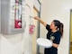 SANTA RITA, Guam (Sept. 12, 2024) - Fire Inspector, Lelani Quenga paints a classroom at Southern High School on Sept. 12. Quenga along with other military and civilian personnel assigned to U.S. Naval Base Guam (NBG), partnered with multiple tenant commands to assist with clean-up efforts at Southern High School (SHS) in Santa Rita-Sumai, Sept. 12.