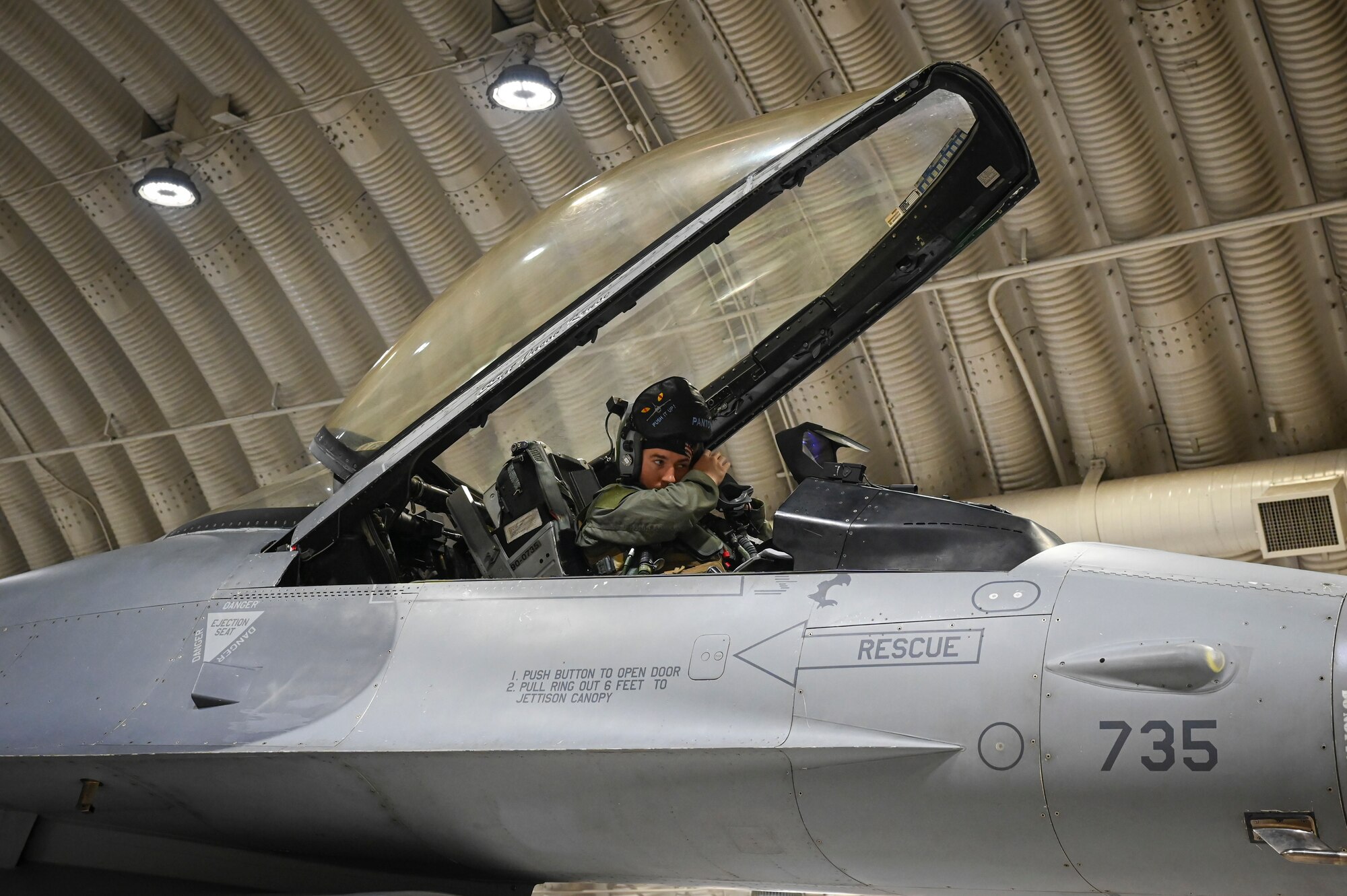 U.S. Air Force Capt. Walker Frazell, 35th Fighter Squadron F-16 Fighting Falcon pilot, conducts a preflight inspection in advance of a training mission.