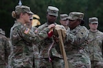 U.S. Army Lt. Col. Jennifer Green and U.S. Army Command Sgt. Maj. Regina Stone, commander and senior enlisted leader of the 110th Combat Sustainment Support Battalion, case the battalion's colors during the unit's departure ceremony Sept. 20, 2024, in Tifton, Georgia. The ceremony was held in honor of the unit's upcoming mobilization to the U.S. Army European Command area of responsibility.