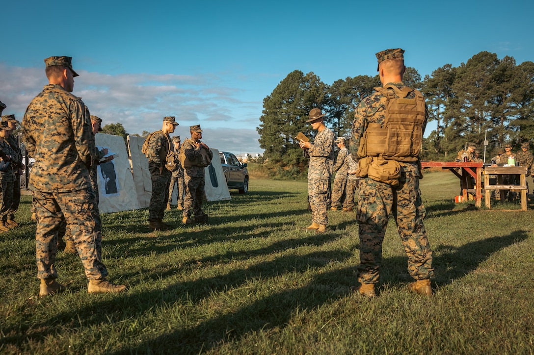 U.S. Marine Corps Brig. Gen. Anthony Henderson, commanding general of Training Command, listens to a range brief before he participates in various rifle drills at Weapons Training Battalion on Marine Corps Base Quantico, Virginia, Sept. 5, 2024. Training Command develops, sustains, and enhances individual military knowledge, skills, and attitudes in Marines to meet warfighting requirements of the total force. (U.S. Marine Corps photo by Lance Cpl. Ethan Miller)