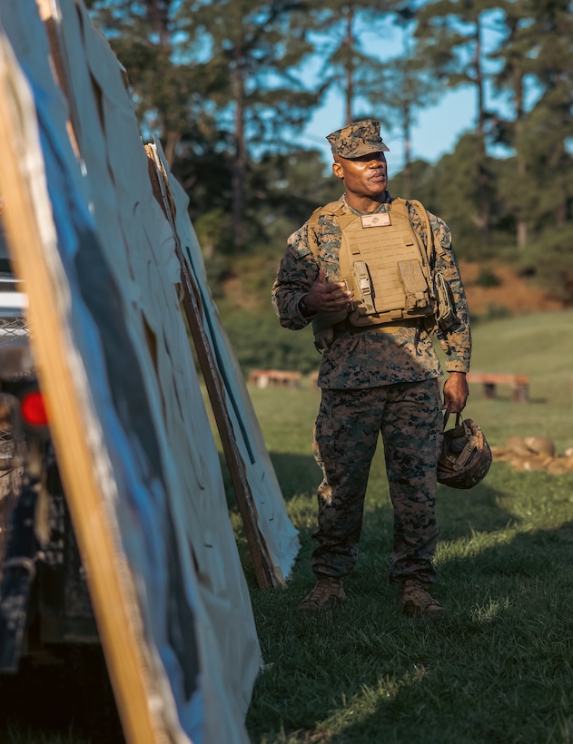 U.S. Marine Corps Brig. Gen. Anthony Henderson, commanding general of Training Command, speaks about the different targets before he participates in various rifle drills at Weapons Training Battalion on Marine Corps Base Quantico, Virginia, Sept. 5, 2024. Training Command develops, sustains, and enhances individual military knowledge, skills, and attitudes in Marines to meet warfighting requirements of the total force. (U.S. Marine Corps photo by Lance Cpl. Ethan Miller)