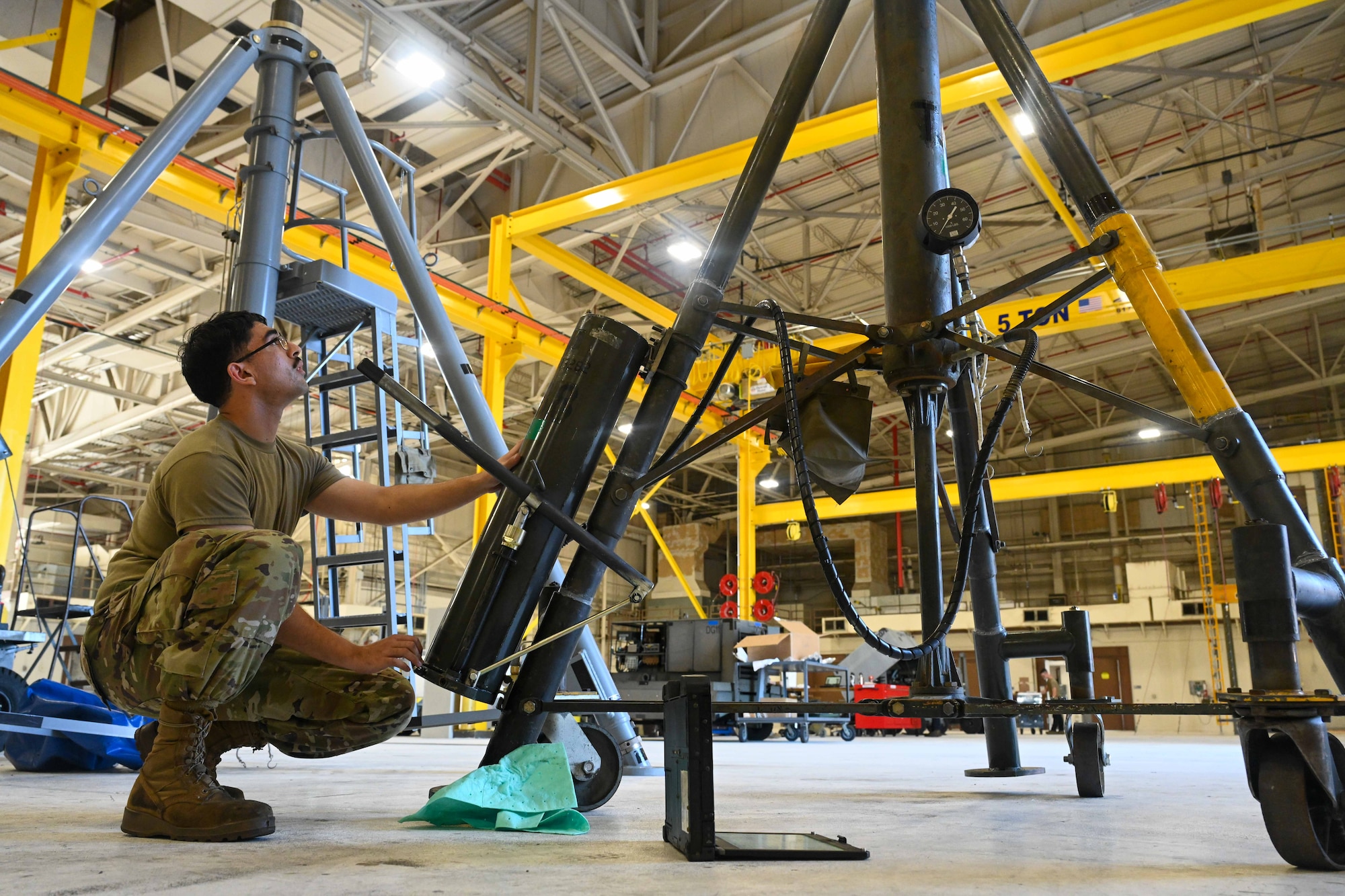 Airman 1st Class Castillo Miranda, 22nd Maintenance Squadron aerospace ground equipment apprentice, works on a tripod jack Sept. 18, 2024, at McConnell Air Force Base, Kansas. The maintenance sections in the Air Force are responsible for ensuring aircraft and equipment are operational and conducting inspections and repairs to maintain readiness and safety for mission success. (U.S. Air Force photo by Senior Airman William Lunn)