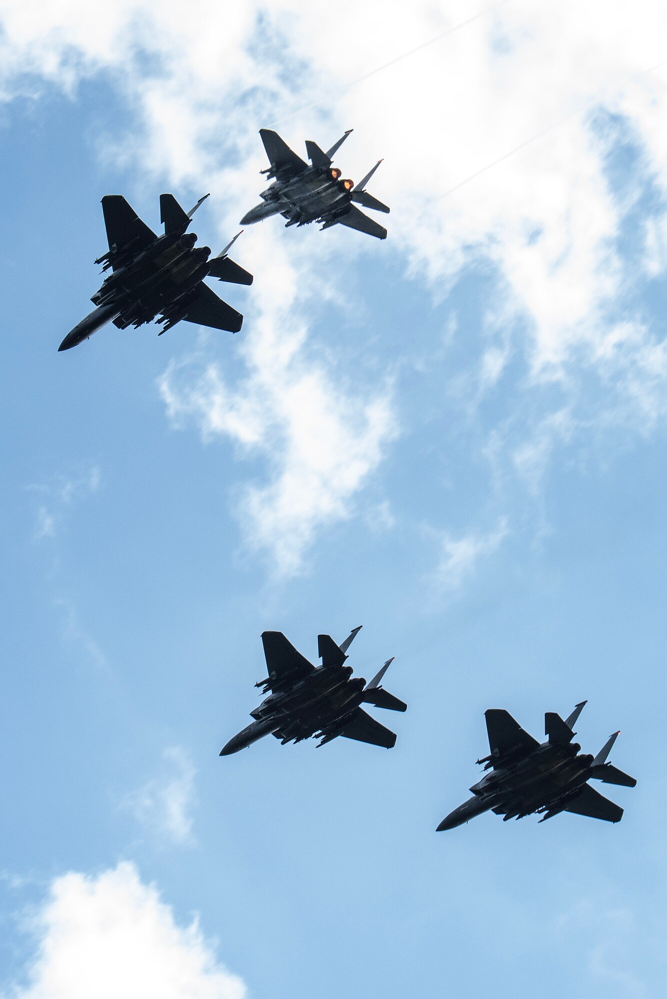 F-15E Strike Eagles perform a missing man formation flyover in support of of National POW/MIA Recognition Day.