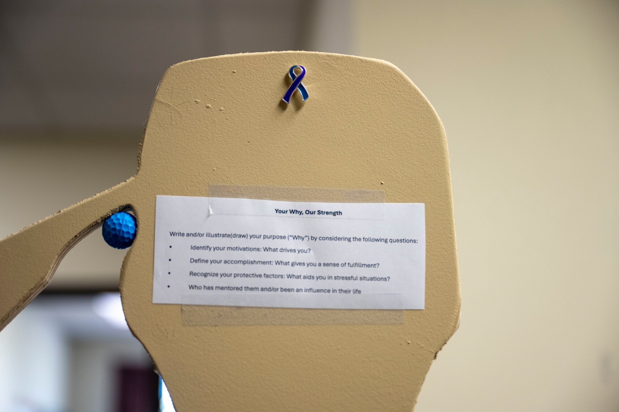 The prompt for the Suicide Awareness exhibit at McConnell Air Force Base, Kansas, Sept. 17, 2024. Each squadron received a wooden cutout for Airmen to fill with their “why” from Sept. 1-17 for display at the Robert J. Dole Center from Sept. 18-30. (U.S. Air Force photo by Senior Airman Felicia Przydzial)
