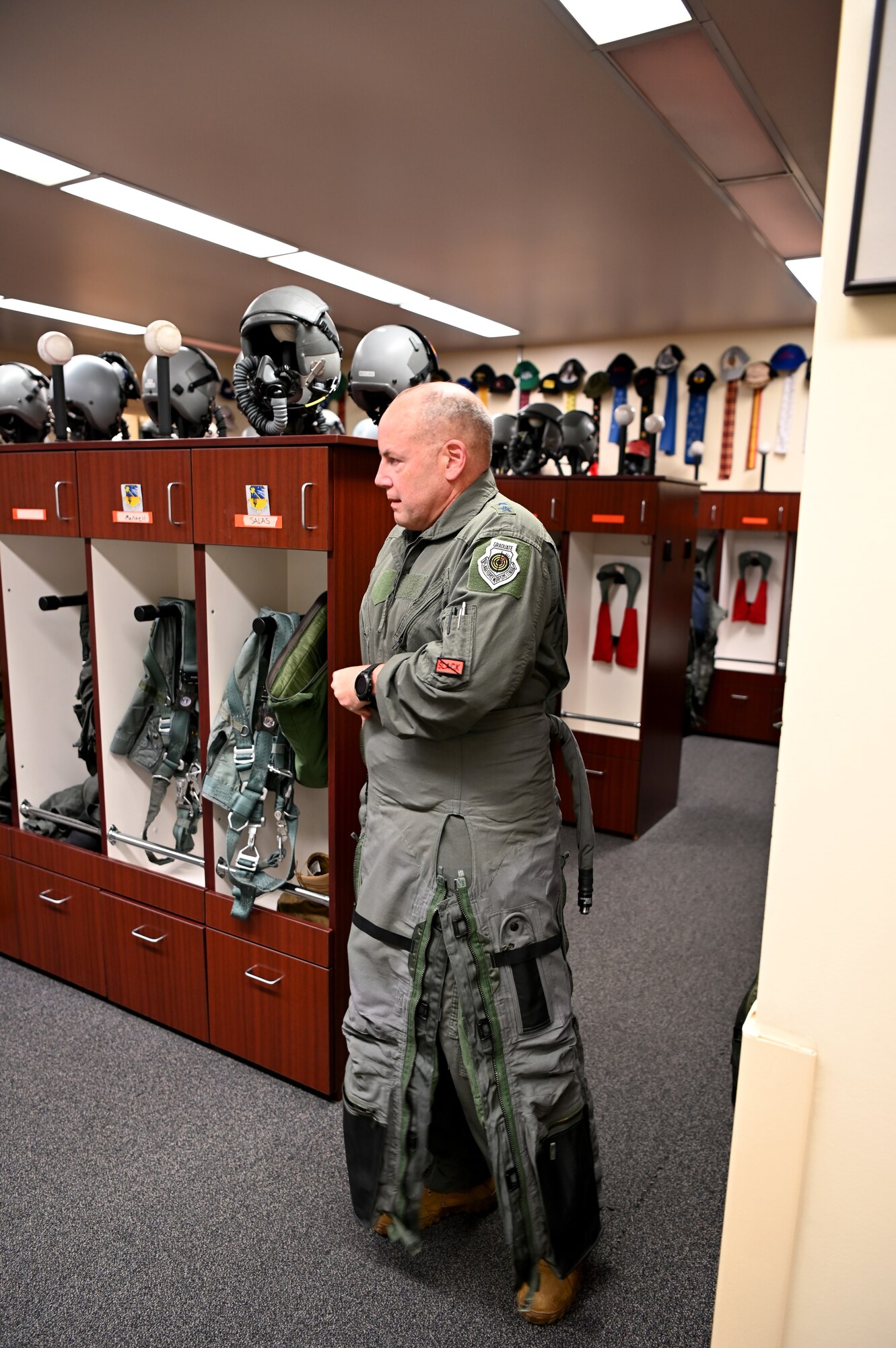 U.S. Air Force Maj. Gen. Duke Pirak, Deputy Director, Air National Guard, puts on his G-suit as he prepares to fly the F-15 Eagle.