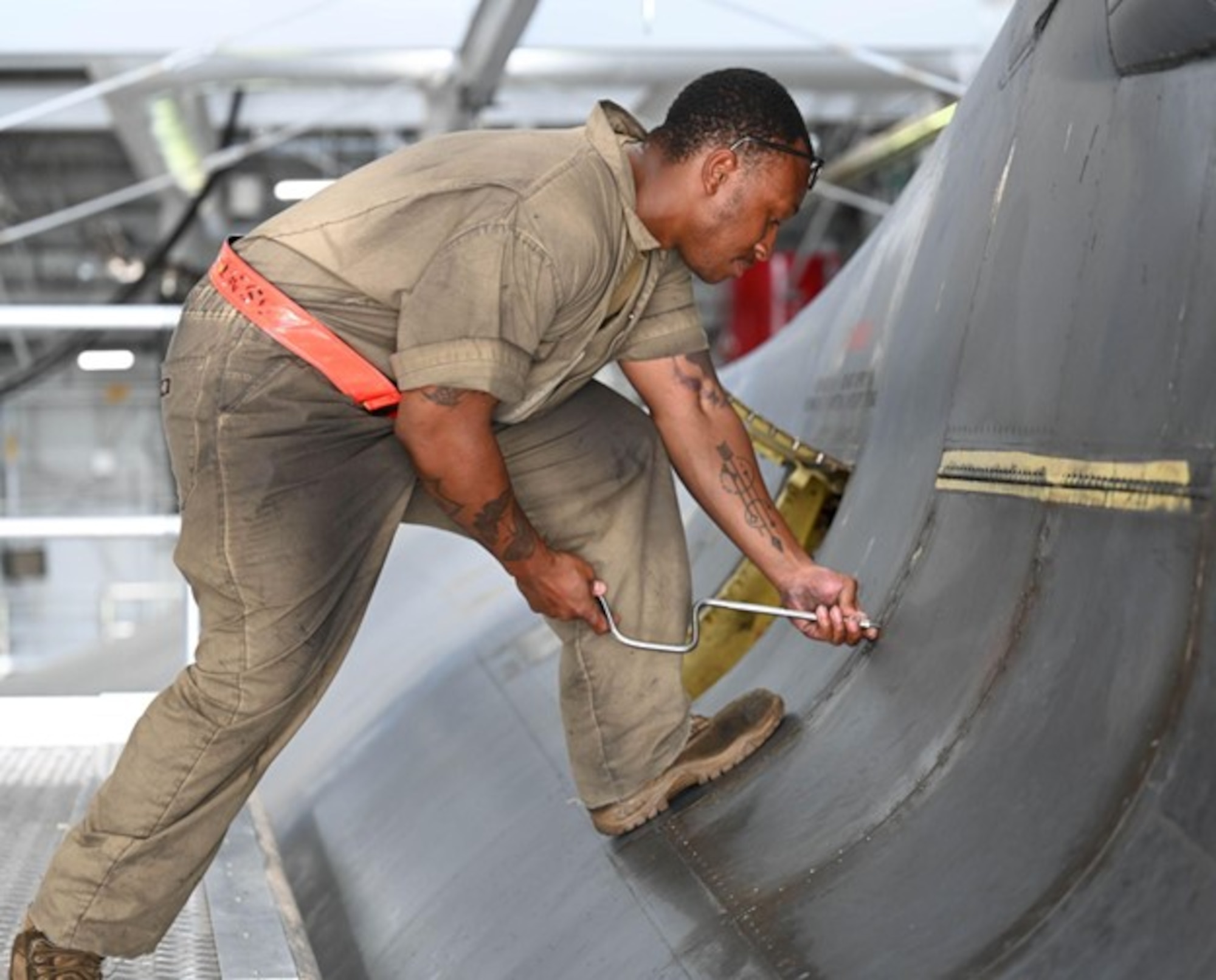 U.S. Air Force Senior Airman TreQuawn Tomlin, 34th Bomber Generation Squadron crew chief, performs maintenance on a B-1B Lancer in support of exercise Raider Reach at Ellsworth Air Force Base, S.D., Sept. 17, 2024.