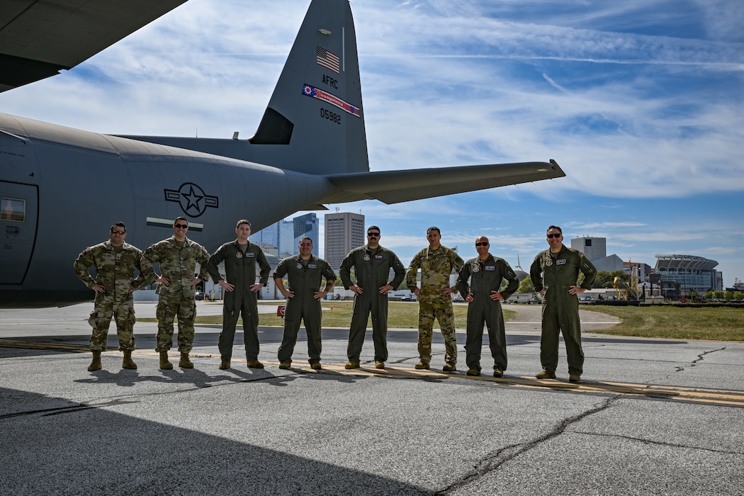 A 757th Airlift Squadron C-130J-30 Super Hercules aircrew poses for a photo at Burke Lakefront Airport after flying over Huntington Bank Field in Cleveland, Ohio, Sept. 22, 2024.