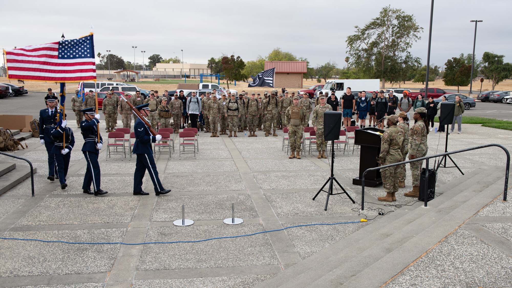 Airmen standby as honor guard present the colors