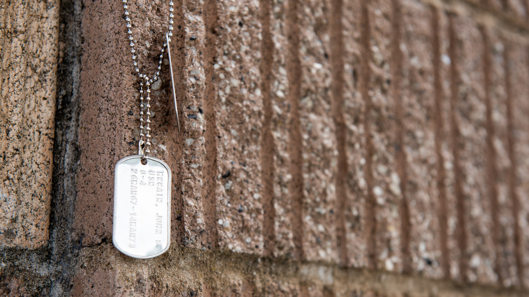 Dog tags hang on wall