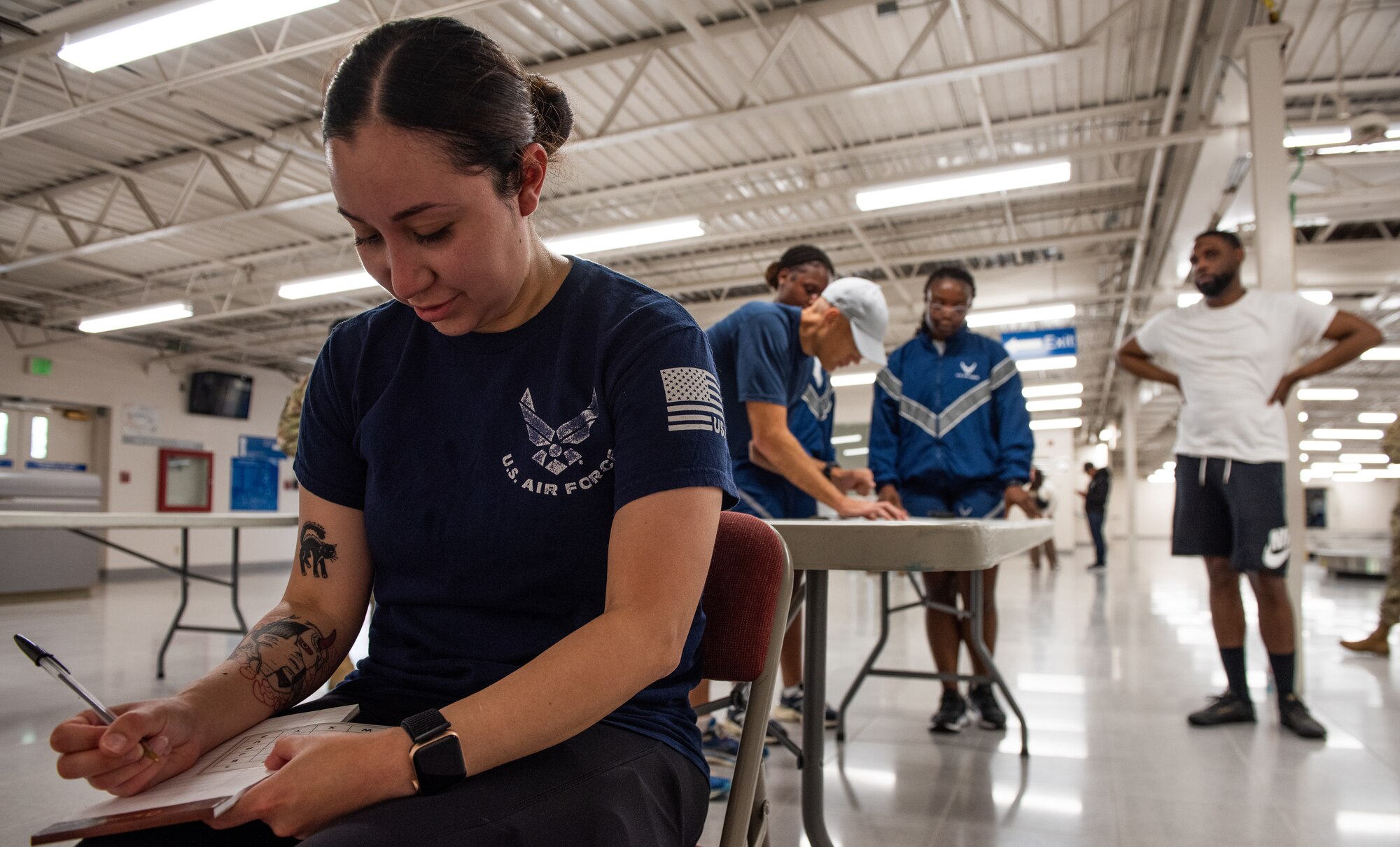 Airmen jots down information