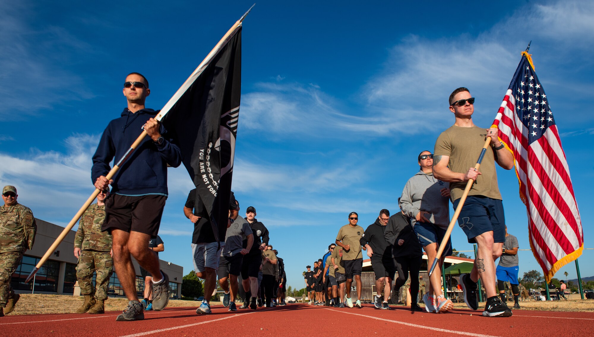 Airmen run on base track