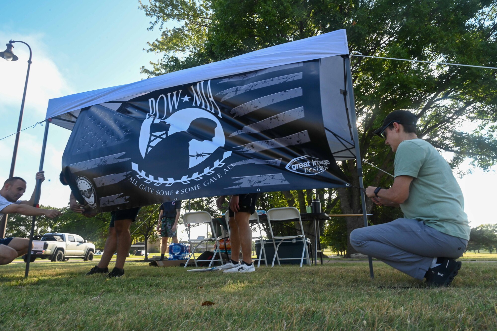 Airmen from Team McConnell set up a medical tent in preparation for the POW/MIA remembrance week  24-hour vigil walk/run Sept. 16, 2024, at McConnell Air Force Base, Kansas. The week honors more than 81,500 U.S. service members who remain unaccounted for. (U.S. Air Force photo by Senior Airman William Lunn)