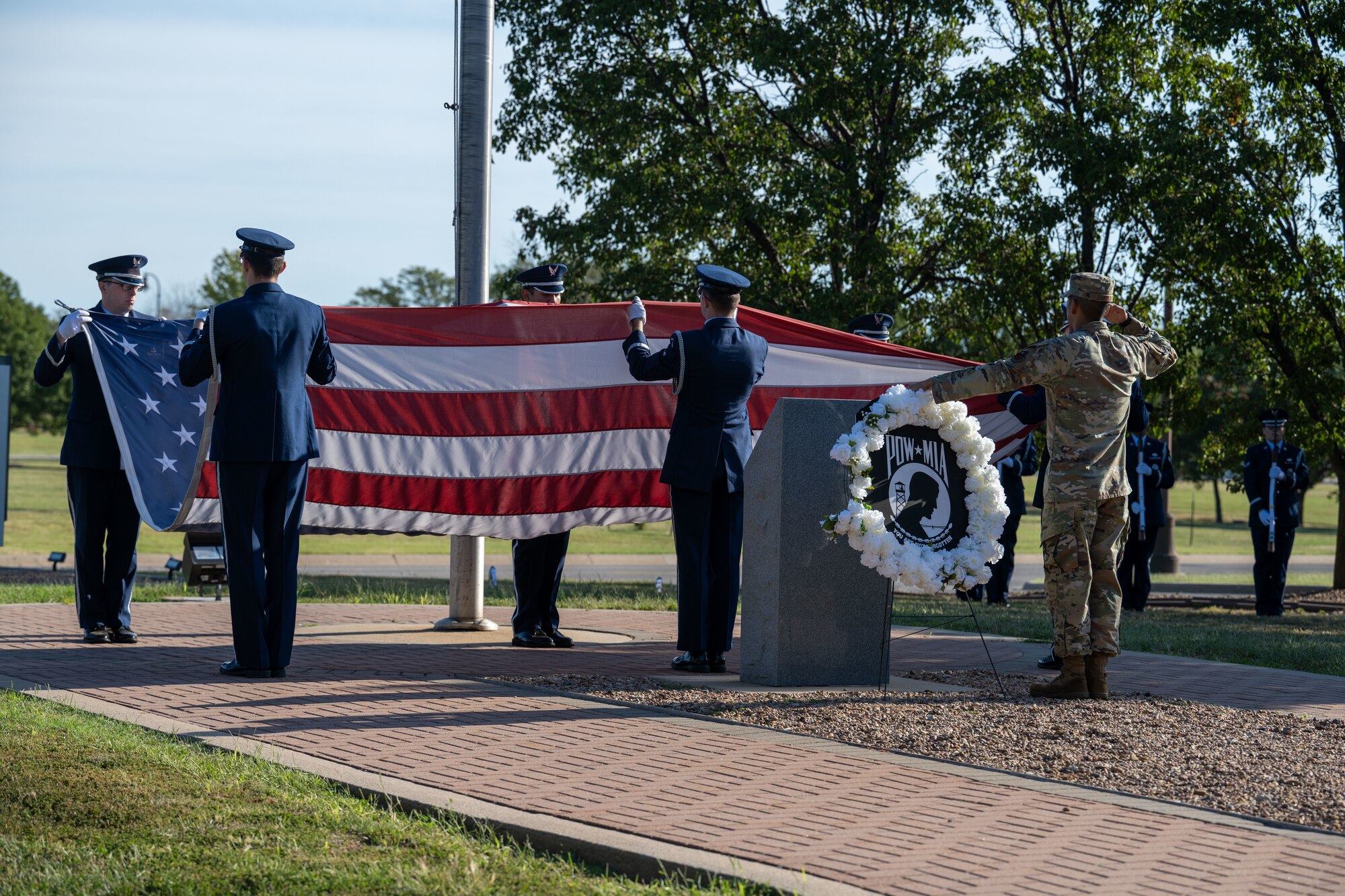 The 22nd Air Refueling Wing Honor Guard folds the American flag during the POW/MIA week opening ceremony at McConnell Air Force Base, Kansas, Sept. 16, 2024. The week honors more than 81,500 U.S. service members who remain unaccounted for. (U.S. Air Force photo by Airman 1st Class Paula Arce)