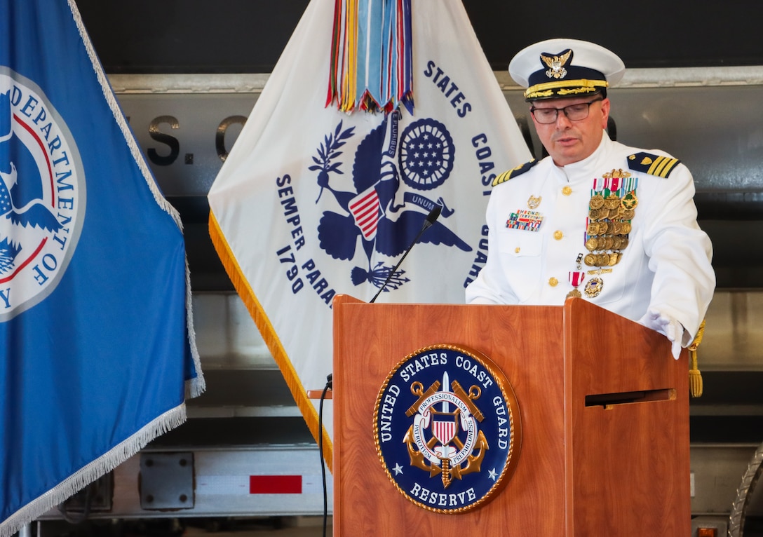 Cmdr. Todd A. Remusat addresses guests and Coast Guard Port Security Unit (PSU) 309 service members during the unit's change of command ceremony in Port Clinton, Ohio, Sept. 21, 2024. Remusat served as PSU 309's commanding officer from June 2021 to September 2024 and led the unit of 140 members through multiple active-duty training operations, including a first-of-its-kind joint force training operation including multiple PSUs elements along with U.S. Navy, U.S. Marines, and U.S. Army personnel in Puerto Rico in April 2024. (U.S. Coast Guard photo by Petty Officer 2nd Class Joshua Sanchez)