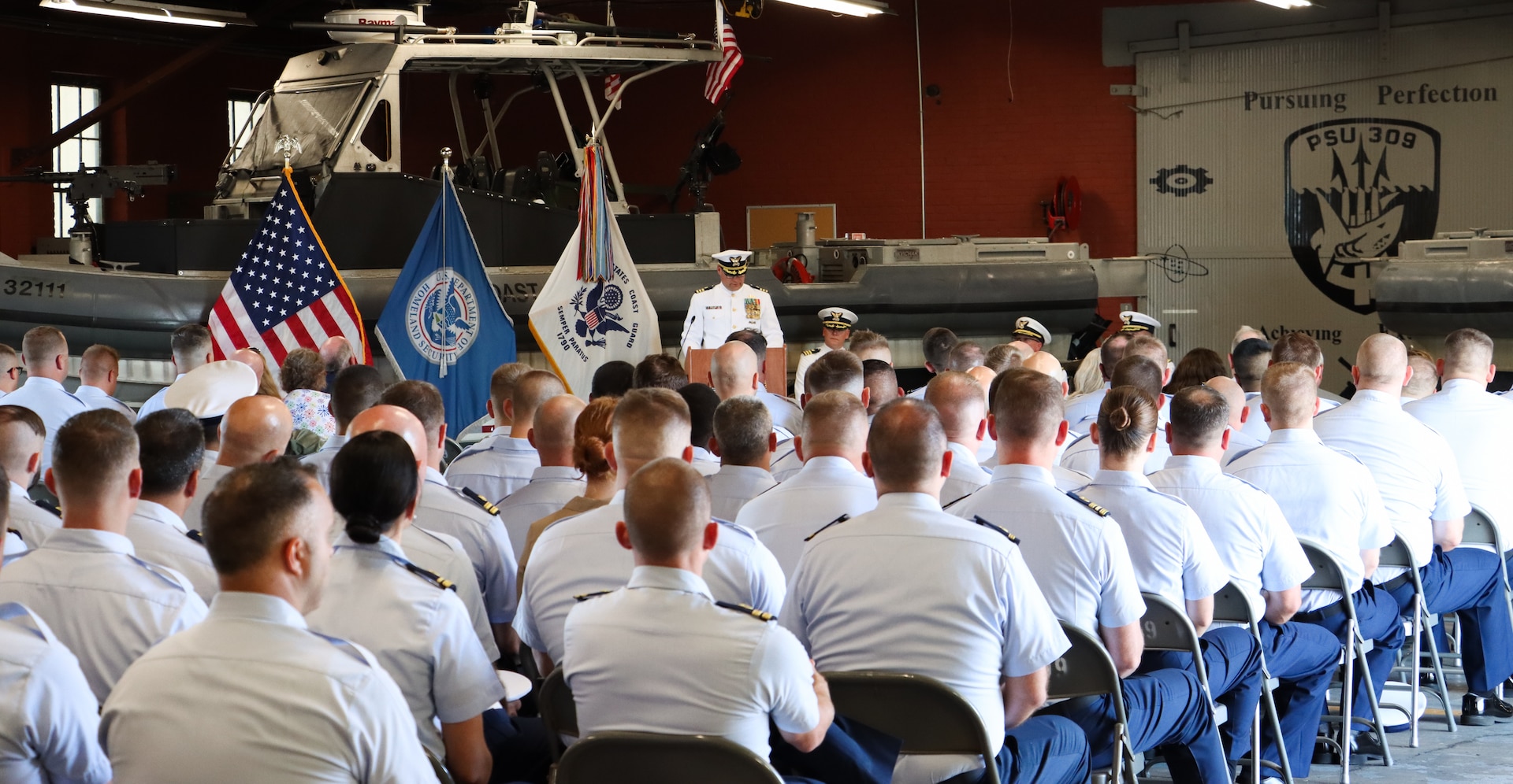 Cmdr. Kristopher J. Nolan delivers remarks after assuming command of Coast Guard Port Security Unit 309 during the unit’s change of command ceremony in Port Clinton, Ohio, Sept. 21, 2024.  Nolan was previously assigned as the senior reserve officer at Coast Guard Sector Lake Michigan. (U.S. Coast Guard photo by Petty Officer 2nd Class Joshua Sanchez)